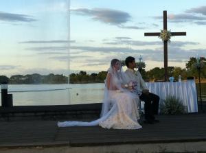The Third Party in the marriage represented by the only altar decor, the cross.